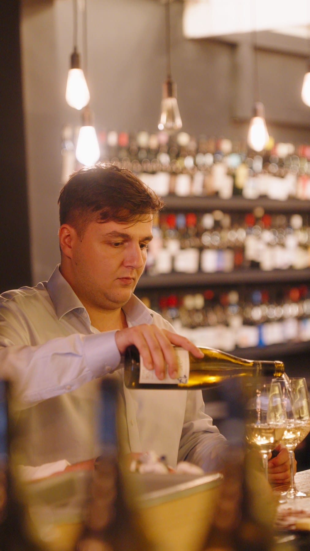 Florian Meyniel pouring wine at LQV Singapore.