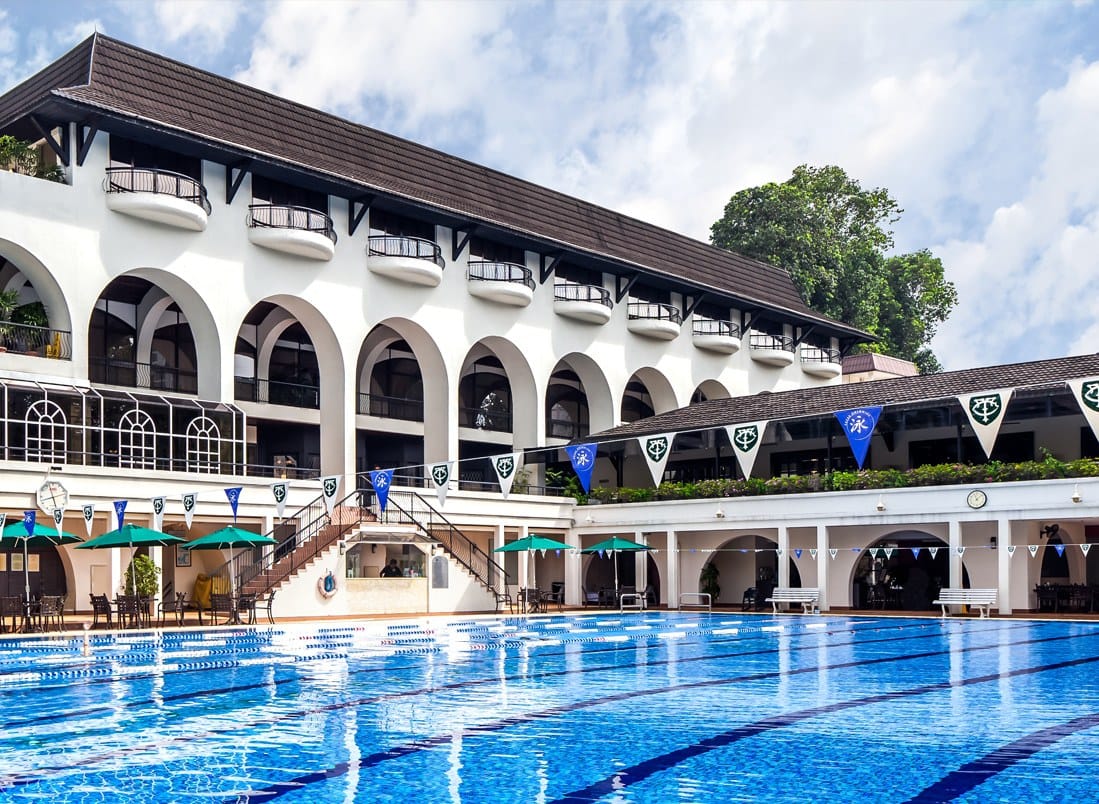 Pool and clubhouse at The Tanglin Club