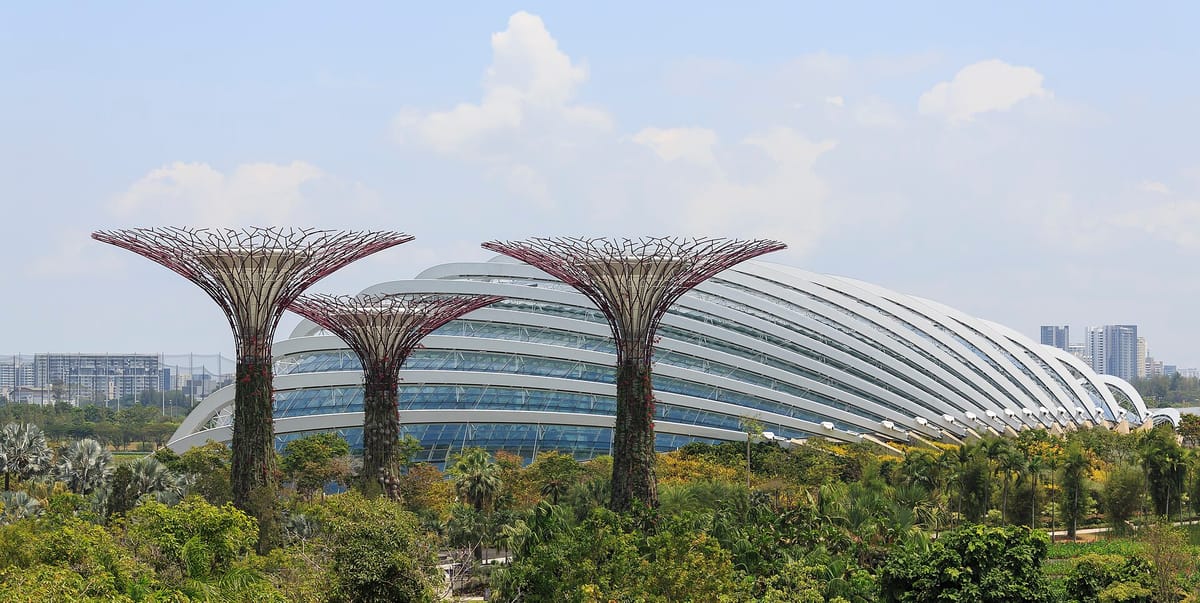Flower Dome at Gardens by the Bay in Singapore with Supertree Grove in the foreground