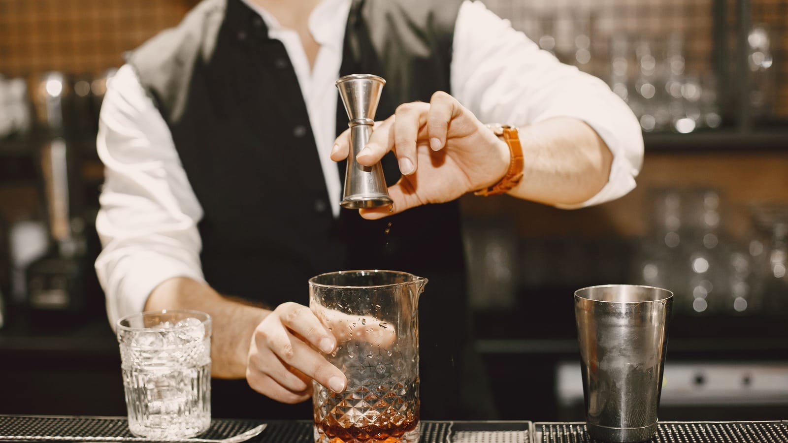 Intimate craft cocktail bar with bartender