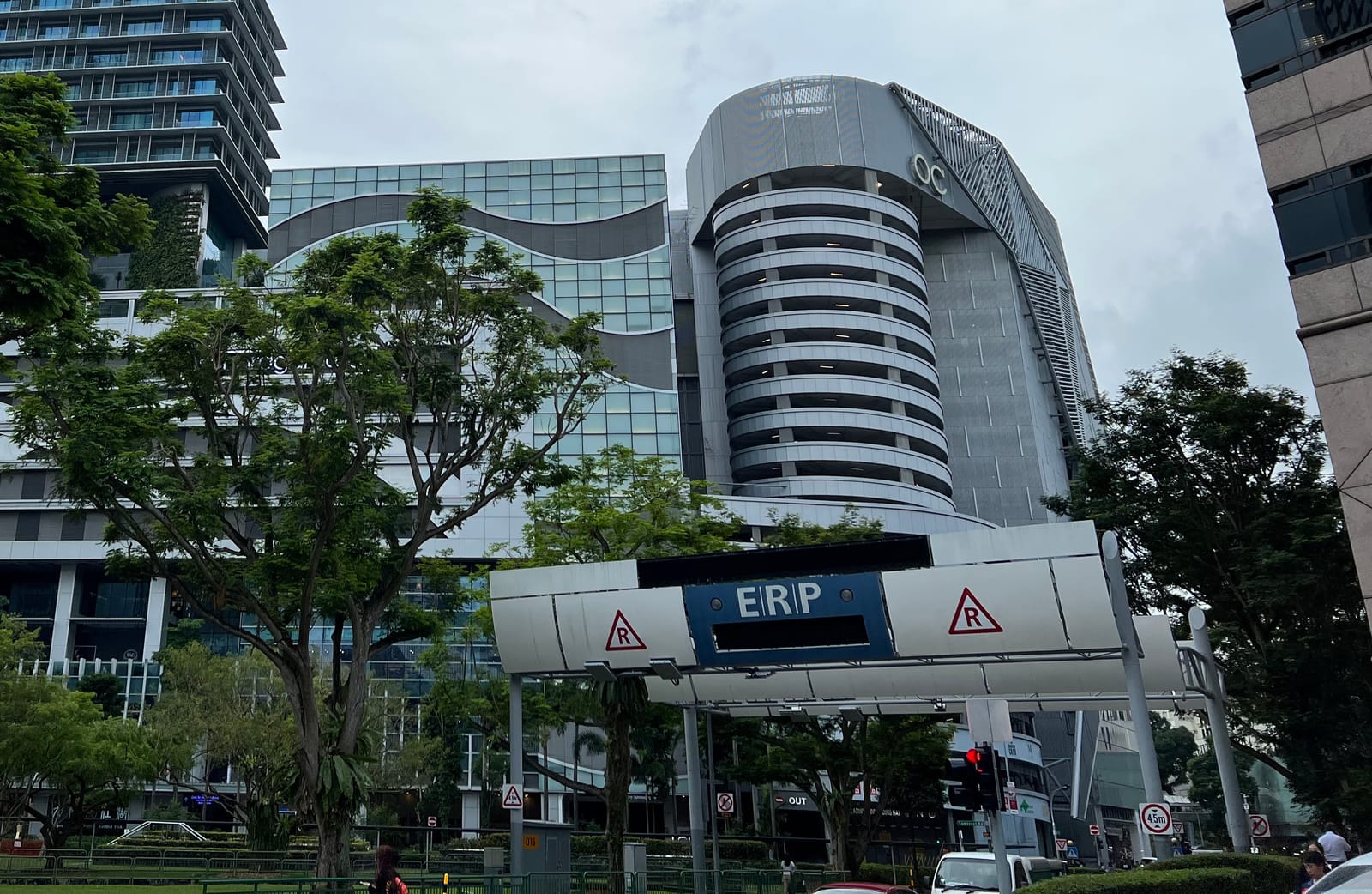 Electronic Road Pricing gantry on Killiney Road in Singapore, with buildings and trees behind it.