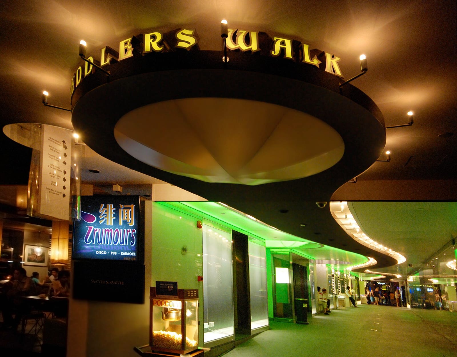 Neon-lit covered walkway with bars and restaurants at Clarke Quay, Singapore