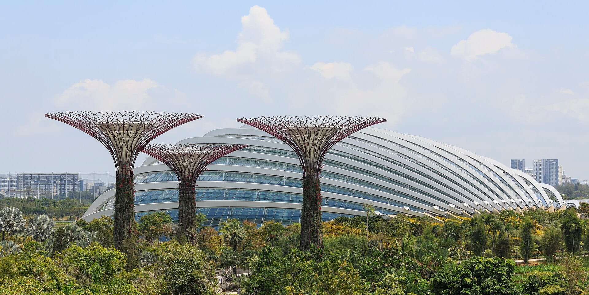 Flower Dome at Gardens by the Bay in Singapore with Supertree Grove in the foreground